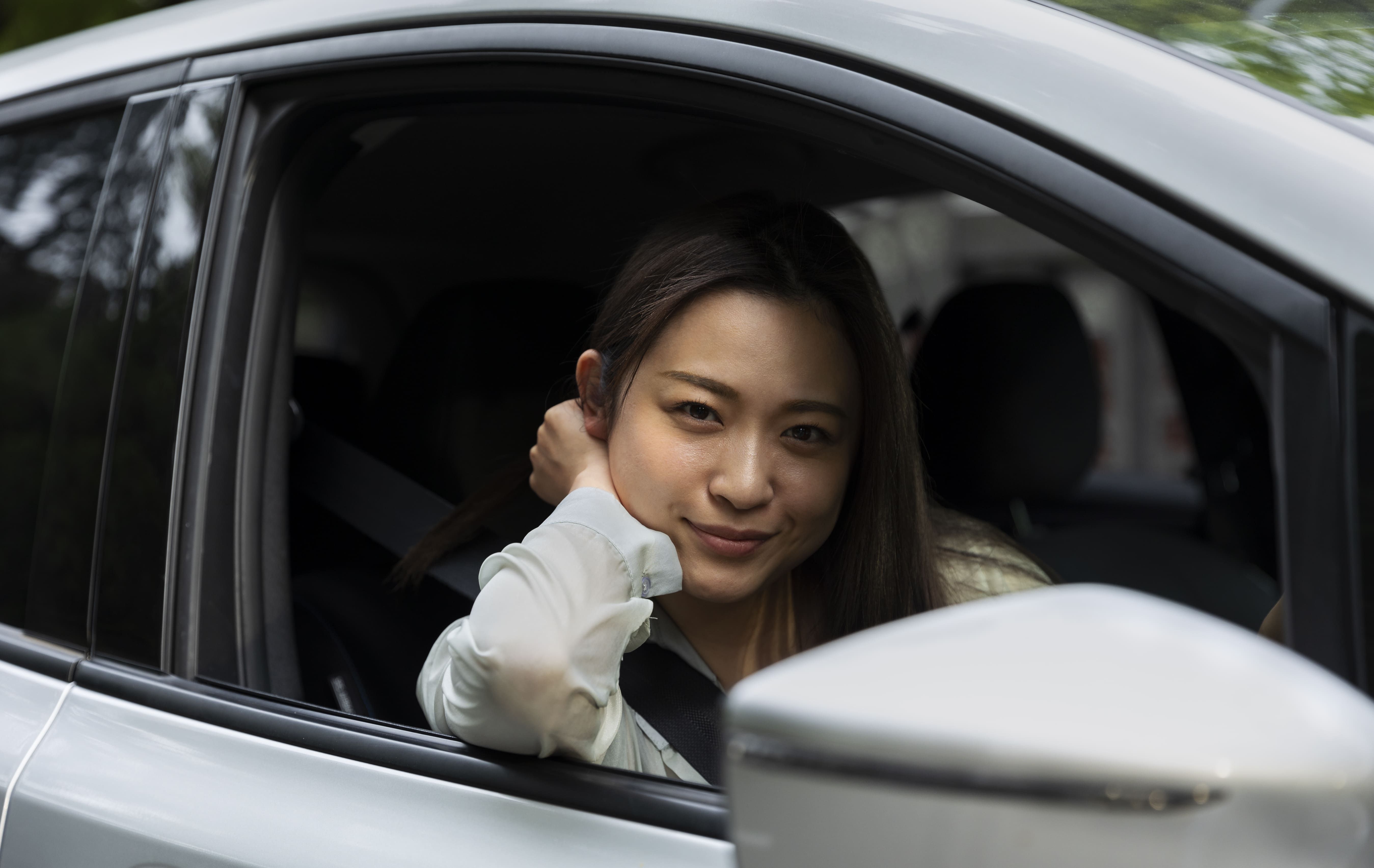 female-driver-posing-electric-car (1) (1).jpg